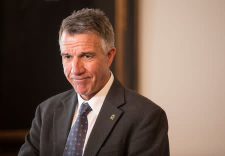 FILE PHOTO: Vermont governor Phil Scott speaks to the press in his offices at the State Legislature in Montpelier, Vermont, U.S., March 13, 2018. REUTERS/Christinne Muschi/File Photo