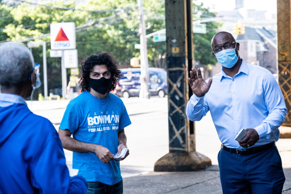 Jamaal Bowman, right, greets people outside a subway station in the Bronx. His presence in the district became a key way to distinguish himself from Rep. Eliot Engel (D-N.Y.). (Photo: Jeenah Moon/Getty Images)