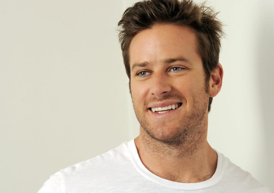 In this Monday, June 10, 2013 photo, actor Armie Hammer laughs as he poses for a portrait at the Pacific Design Center in West Hollywood, Calif. Hammer takes on his first major leading-man role opposite Johnny Depp in “The Lone Ranger.” The movie releases July 3, 2013. (Photo by Chris Pizzello/Invision/AP)