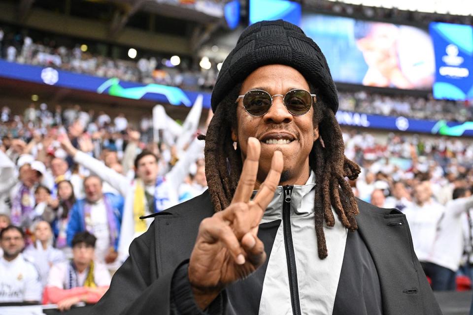 Jay-Z gestures ahead of the UEFA Champions League final football match between Borussia Dortmund and Real Madrid, at Wembley stadium, in London.