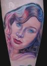 <div class="caption-credit"> Photo by: Mike Devries/mdtattoos.com</div>This Tori Amos tattoo would look great with an eyebrow ring and some store-bought angel wings. Had I known tattoos went beyond tribal arm cuffs in the '90s, this would have been a photo of my limb.