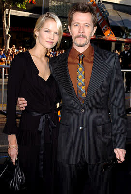 Premiere: Gary Oldman with Alisa Marshall at the Hollywood premiere of Warner Bros. Pictures' Batman Begins - 6/6/2005 Photo: Steve Granitz, WireImage.com