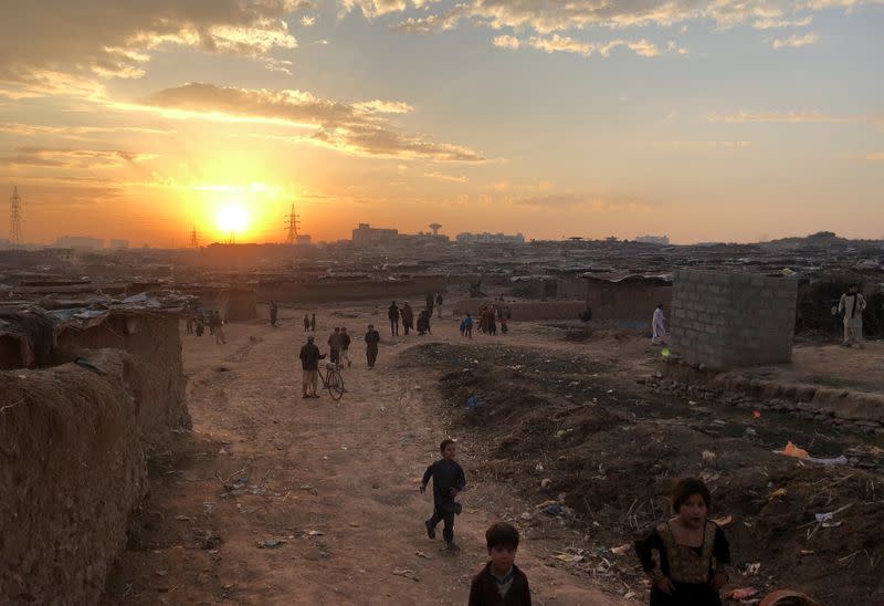 A general view of Afghan refugee camp during sun setting behind the horizon in Islamabad