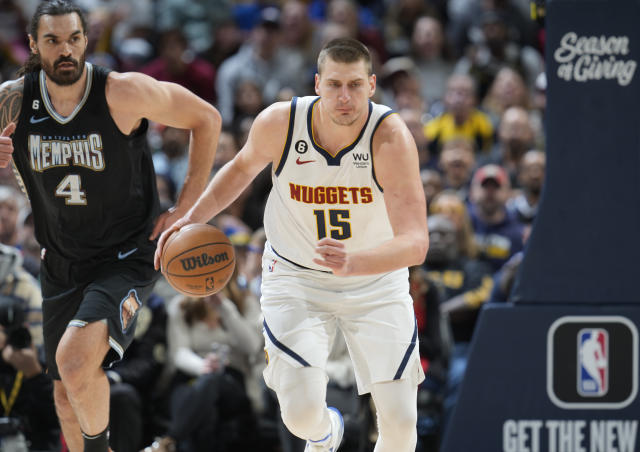 Broncos legend Peyton Manning celebrates Nuggets championship courtside