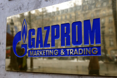 FILE PHOTO: The logo of Gazprom marketing department is seen in front of the office located on the Champs Elysees in Paris ,January 5, 2009. REUTERS/Charles Platiau