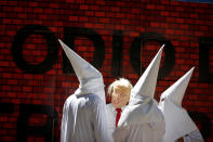 <p>Actors impersonating U.S. President Donald Trump and members of the Ku Klux Klan stage a performance on behalf of a local Mexican political party during a protest against Trump, in Mexico City, Mexico Feb. 20, 2017. The writing on the mock wall reads “Hatred”. (Photo: Jose Luis Gonzalez/Reuters) </p>