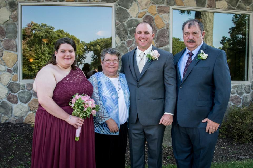 The Malinowski family at the wedding of Frank "Keith" Malinowski, second from right, including his father Frank, on right, sister Jamie, and mother Jody.
