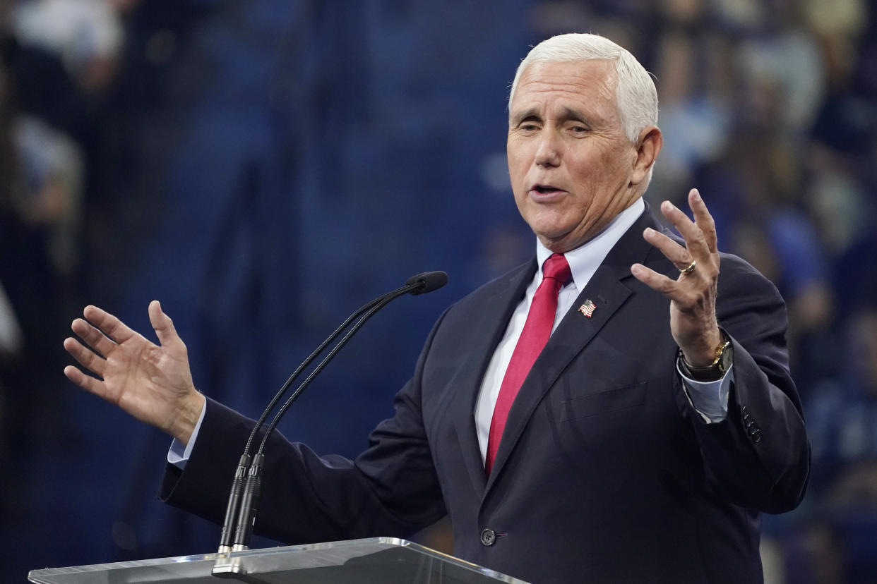 FILE - Former Vice President Mike Pence gestures as he addresses the Convocation at Liberty University, Sep. 14, 2022, in Lynchburg, Va. By refusing to go along with former president Donald Trump’s unconstitutional push to overturn the results of the 2020 election, Pence became a leading target of Trump’s wrath and a pariah in many Republican circles. But in the final weeks of an intensely competitive midterm election, Pence’s fortunes may be shifting. He’s an in-demand surrogate for Republican campaigns, including from some candidates who have spent much of the year hugging Trump and parroting his lie that the election was stolen. (AP Photo/Steve Helber, File)