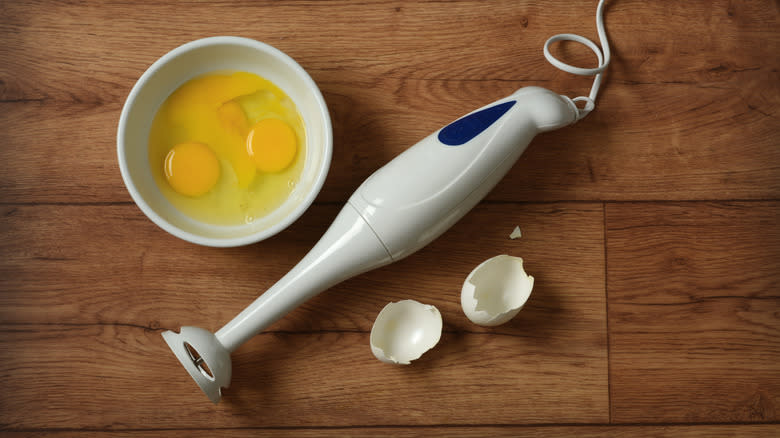 eggs in bowl and immersion blender