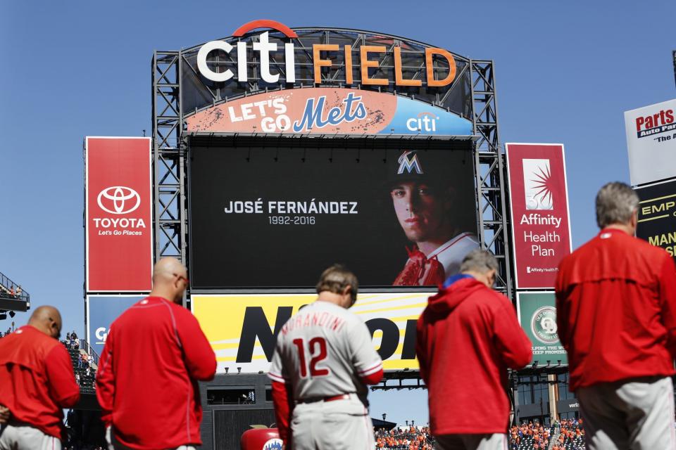 <p>Members of the Philadelphia Phillies participate in a moment of silence to remember Miami Marlins Jose Fernandez before the baseball game against the New York Mets at Citi Field, Sunday, Sept. 25, 2016 in New York. (AP Photo/Seth Wenig) </p>