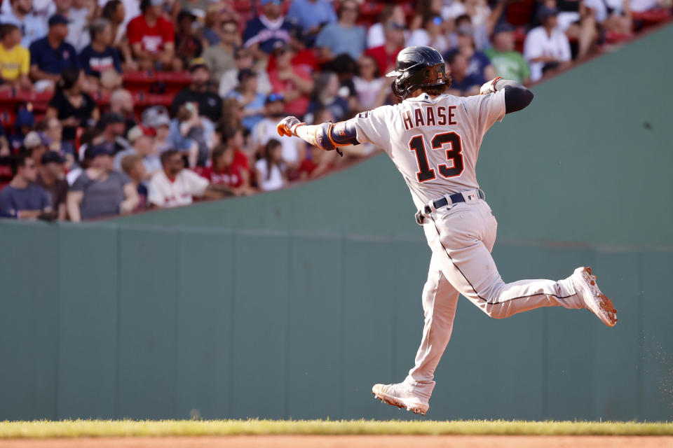 Detroit Tigers' Eric Haase celebrates as he rounds the bases after hitting a home run during the fifth inning of a baseball game against the Boston Red Sox at Fenway Park, Saturday, Aug. 12, 2023, in Boston. (AP Photo/Mary Schwalm)