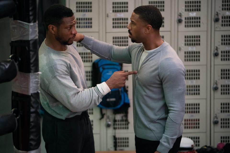 Boxing champ Adonis Creed (Michael B. Jordan, right) faces a new threat from Damian Anderson (Jonathan Majors), a former childhood friend just out of jail, in "Creed III."