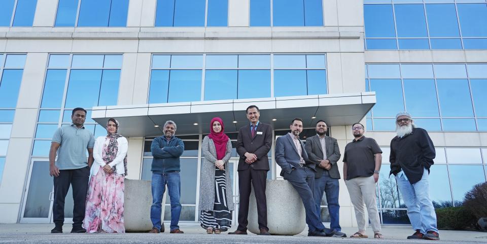 The Noor Islamic Cultural Center recently purchased a 220,000-square-foot office building near their mosque. Stakeholders include, from left, Taj Mohammed, Rubi Taj, Atif Syed, Atifa and Imran Malik, Ronney Abaza, Mahmood Khan, Shams Khan and Mohammed Azhar Masood.