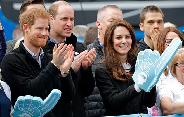 Kate and Wills were joined by Prince Harry at the water station. Photo: Getty