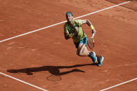 Spain's Rafael Nadal runs to return the ball to Norway's Casper Ruud during their final match of the French Open tennis tournament at the Roland Garros stadium Sunday, June 5, 2022 in Paris. (AP Photo/Thibault Camus)