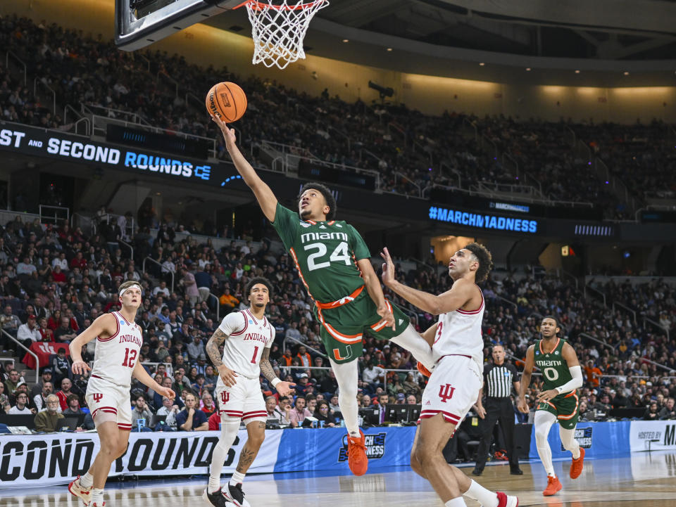 Miami guard Nijel Pack (24) scores against Indiana during the first half of a second-round college basketball game in the men's NCAA Tournament on Sunday, March 19, 2023, in Albany, N.Y. (AP Photo/Hans Pennink)