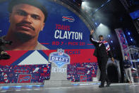 Travis Clayton reacts after being picked by the Buffalo Bills with the 221st overall pick in the seventh round during the third day of the NFL football draft, Saturday, April 27, 2024, in Detroit. (AP Photo/Jeff Roberson)