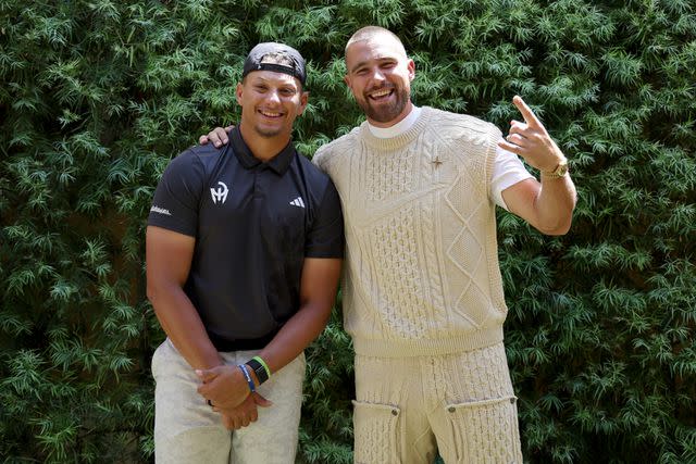 <p>Ezra Shaw/Getty </p> Patrick Mahomes (L) and Travis Kelce of the Kansas City Chiefs pose for photos prior to Capital One's The Match VIII