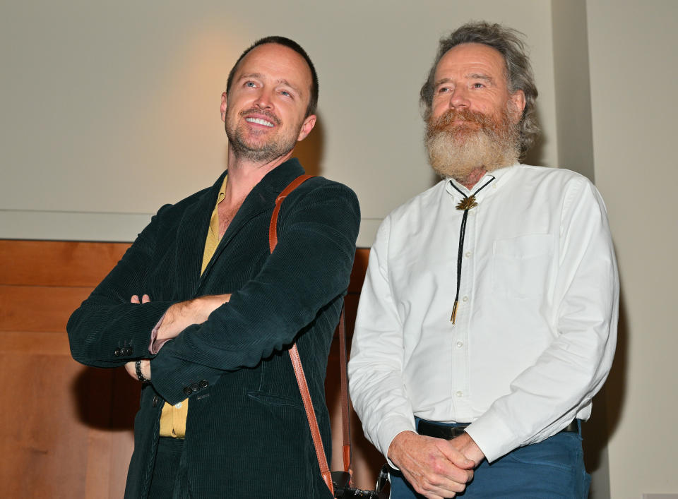 ALBUQUERQUE, NEW MEXICO - JULY 29:  Actor Aaron Paul (L) and actor Bryan Cranston look on during an unveiling ceremony of bronze statues depicting television characters Walter White, played by Cranston, and Jesse Pinkman, played by Paul, from the series 