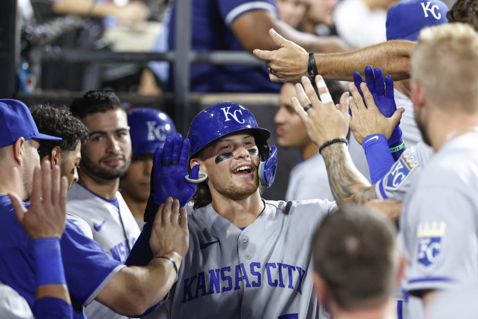 Kansas City Royals' Bobby Witt Jr. hits celebrates with teammates after hitting a solo home run off Chicago White Sox starting pitcher Lance Lynn during the fourth inning of a baseball game Wednesday, Aug. 31, 2022, in Chicago. (AP Photo/Kamil Krzaczynski)
