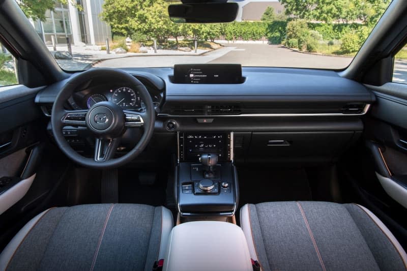 Despite the customary digital instruments, a head-up display and a screen, the MX-30 cockpit is decidedly old-school with its leather and cork trim. Mazda/dpa