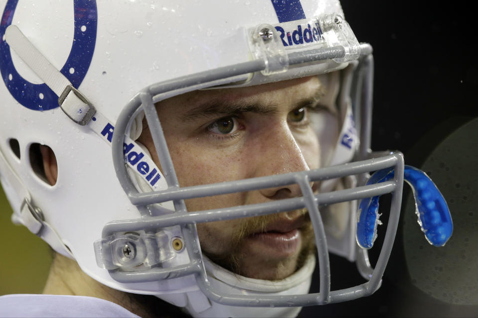 Indianapolis Colts quarterback Andrew Luck watches the action on the field from the sidelines during the second half of an AFC divisional NFL playoff football game against the New England Patriots in Foxborough, Mass., Saturday, Jan. 11, 2014. (AP Photo/Stephan Savoia)