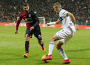 Cagliari's Paolo Faragò, left, and Atalanta's Timothy Castagne vie for the ball during the Italian Cup soccer match between Cagliari and Atalanta at Sardegna Arena in Cagliari, Italy, Monday, Jan. 14, 2019 (Fabio Murru/ANSA via AP)