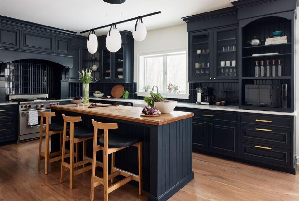 a kitchen with a table and chairs