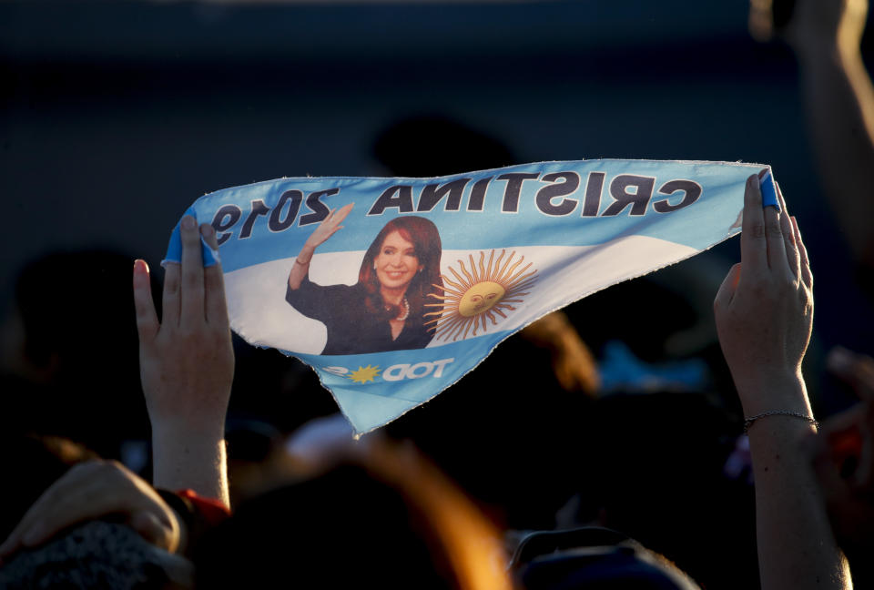 In this Oct. 17, 2019 photo, a supporter holds a bandana featuring former Argentine President Cristina Fernandez de Kirchner, who is running as a vice presidential candidate in the upcoming general elections, during a campaign rally in Santa Rosa, Argentina. Fernandez de Kirchner retains immense popularity among Argentines who view her as a champion of the poor. Supporters wear T-shirts with her image, refer to her affectionately by her initials “CFK” and barely mention a running mate who was once Cabinet chief when she was president. (AP Photo/Natacha Pisarenko)