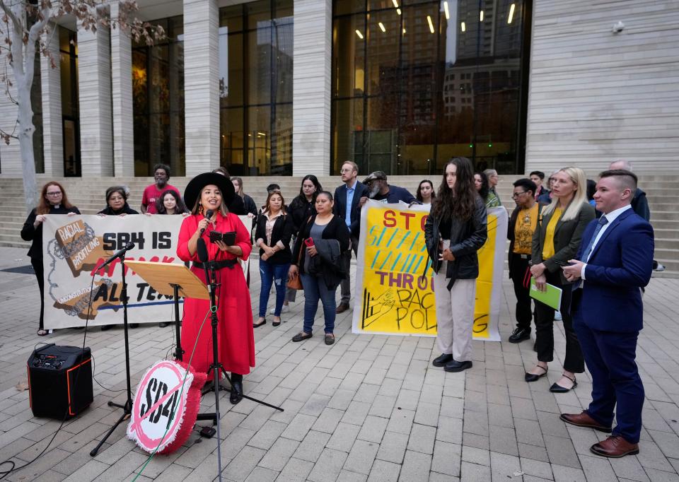 Jennefer Canales-Pelaez, of the Immigrant Legal Resource Center, speaks Feb. 15 at a news conference before a court hearing about the constitutionality of Senate Bill 4 at the federal courthouse in Austin. A federal judge on Thursday ruled against that state immigration law.