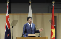 Japan's Prime Minister Shinzo Abe delivers a speech during an opening session of the Comprehensive and Progressive Trans-Pacific Partnership (CPTPP) in Tokyo, Saturday, Jan. 19, 2019. Trade ministers of a Pacific Rim trade bloc are meeting in Tokyo gearing up to roll out and expand the market-opening initiative. (AP Photo/Eugene Hoshiko)