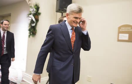 Republican Bill Cassidy talks on a cell phone at an event with supporters, the night of the run-off election for U.S. Senate in Baton Rouge, Louisiana, December 6, 2014. REUTERS/Lee Celano