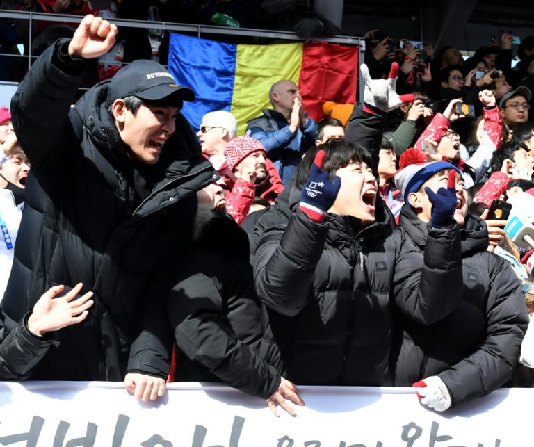 South Korean fans cheer as South Korea's Yun Sungbin gets the gold in the mens's skeleton during the Pyeongchang 2018 Winter Olympic Games on Friday