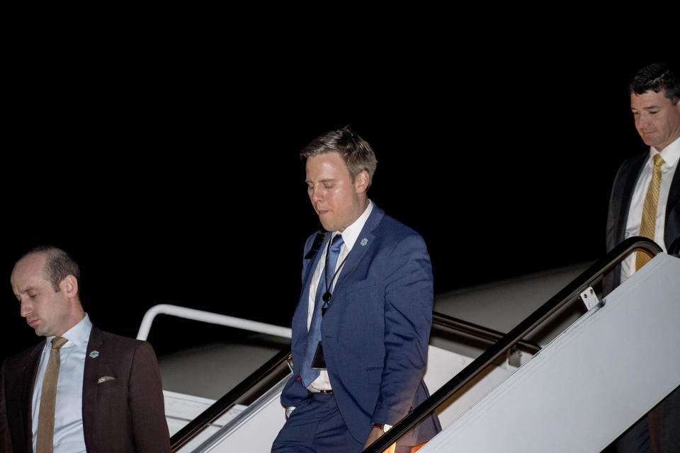 FILE - In this Oct. 13, 2018, file photo President Donald Trump's White House senior adviser Stephen Miller, left, and White House political director Bill Stepien, center, step off Air Force One as they arrives at Andrews Air Force Base, Md., after traveling with President Donald Trump to Richmond, Ky., for a rally. Bill Stepien has replaced Brad Parscale as Trump's campaign manager. (AP Photo/Andrew Harnik)