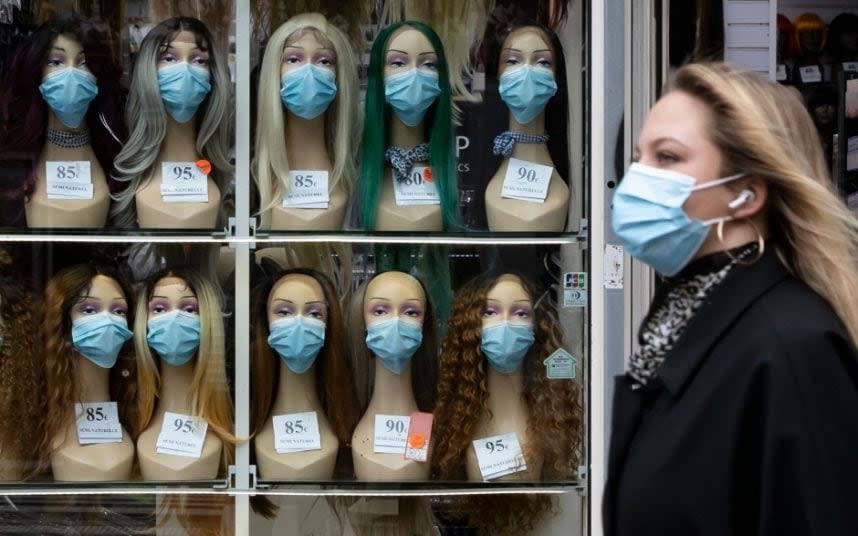 Masked mannequin heads in Paris, where residents are again told to stay at home - IAN LANGSDON/EPA-EFE/Shutterstock