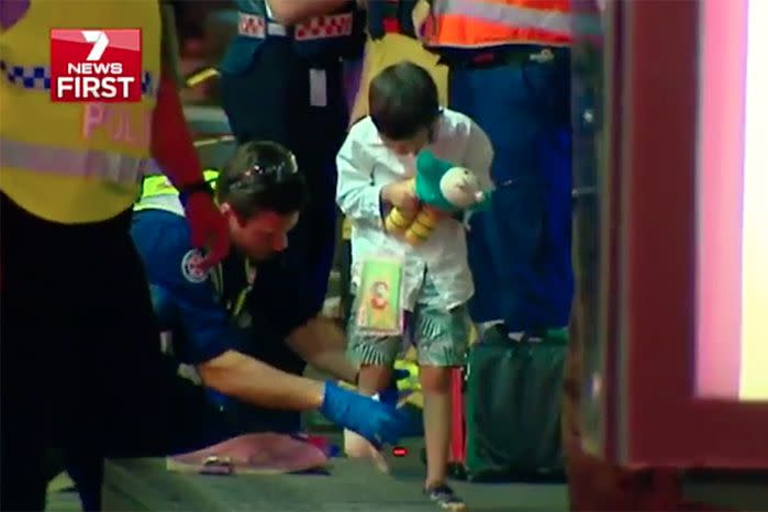 Coby is treated by paramedics at the Haymarket scene. Source: 7 News