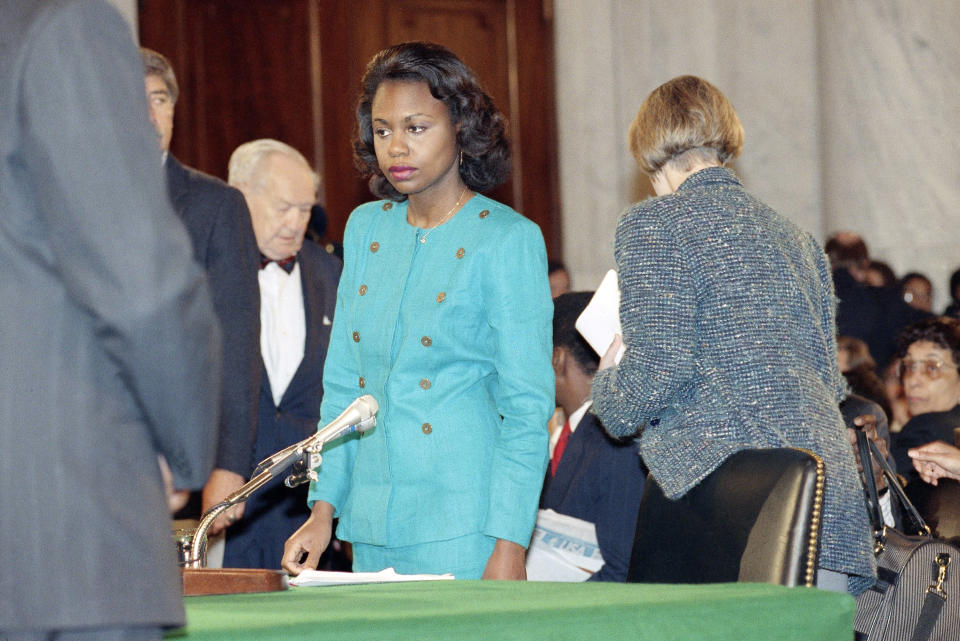 FILE - In this Oct. 11, 1991 file photo, University of Oklahoma law professor Anita Hill stands in the Caucus Room after spending the morning testifying before the Senate Judiciary Committee on Capitol Hill in Washington. “Uncertainty: that's the thing that keeps people from coming forward,” says Hill, who famously came forward herself in 1991 with harassment allegations against Clarence Thomas in his Supreme Court confirmation hearing. “They just don’t know what’s going to happen. And you do know it’s going to be really brutal.” (AP Photo/Greg Gibson, File)