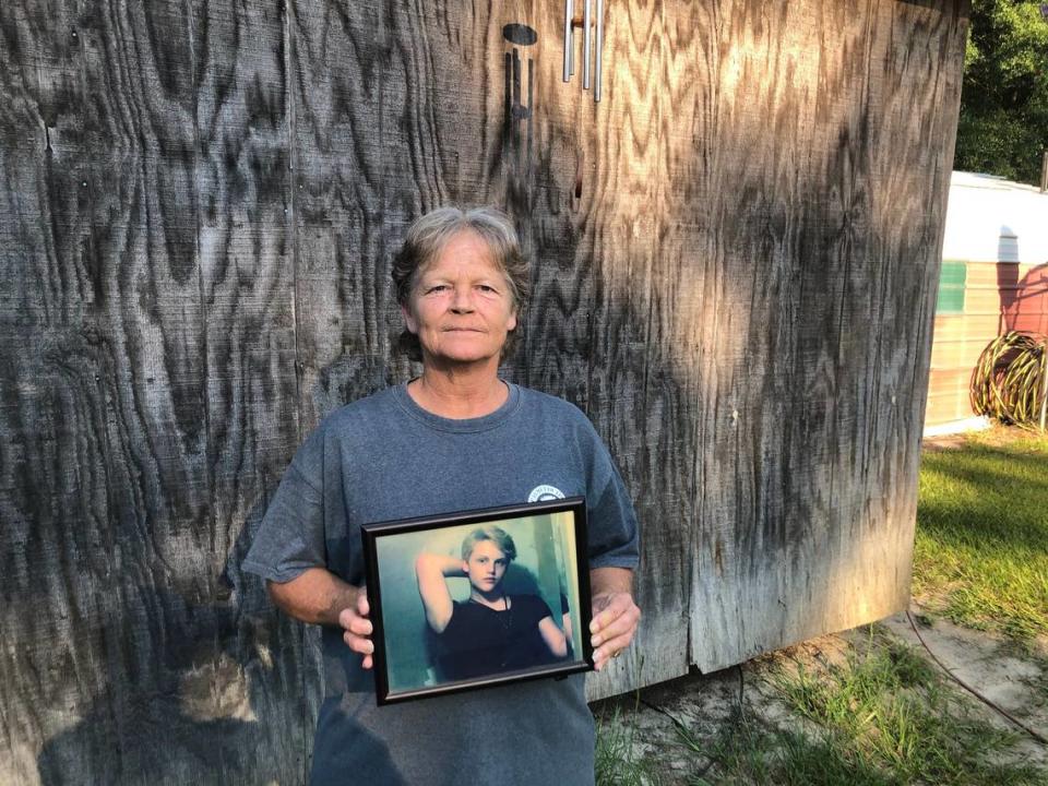 Sandy Smith holds a photo of her late son, 19-year-old Stephen Smith, on June 24, 2021. “There will never be another one like him,” she said.  