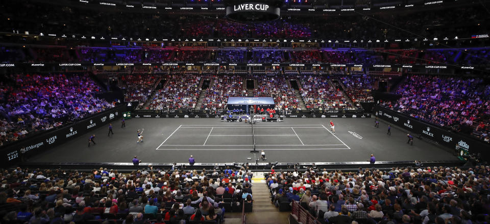 Team Europe's Novak Djokovic, left, hits a return to Team World's Kevin Anderson, right, at the Laver Cup tennis event, Saturday, Sept. 22, 2018, in Chicago. (AP Photo/Kamil Krzaczynski)