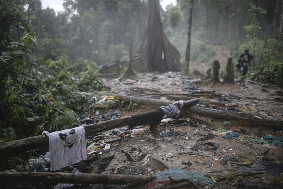 Clothes and garbage litter the trail taken by migrants trekking across the Darien Gap from Colombia to Panama in hopes of reaching the U.S., Wednesday, May 10, 2023. Pandemic-related U.S. asylum restrictions, known as Title 42, are to expire Thursday, May 11. (AP Photo/Ivan Valencia)