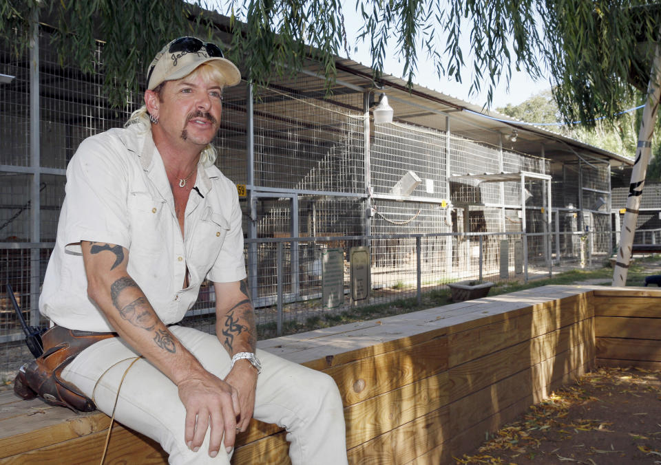 FILE - In this Aug. 28, 2013, file photo, Joseph Maldonado answers a question during an interview at the zoo he runs in Wynnewood, Okla. Federal prosecutors on Friday, Sept. 7, 2018, announced that the zookeeper, also known as &quot;Joe Exotic,&quot; and candidate for governor earlier this year, has been charged in a murder-for-hire scheme alleging he tried to hire someone to kill a Florida woman. Prosecutors allege Maldonado-Passage tried to hire two separate people to kill the woman, who wasn't harmed. Maldonado-Passage finished third in a three-way Libertarian primary in June. (AP Photo/Sue Ogrocki, File)