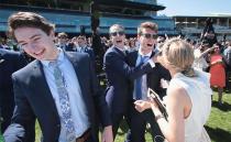 <p>Pictured: Punters brave wild weather as Melbourne Cup festivities get underway</p>