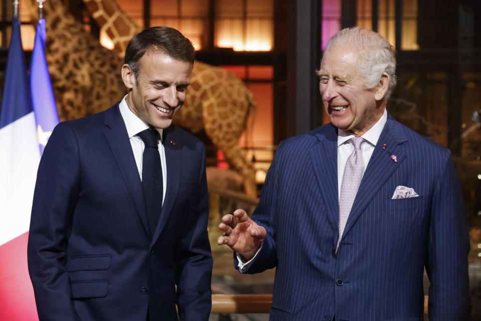 French President Emmanuel Macron and Britain's King Charles III laugh during their visit to the Museum of Natural History to meet business leaders and talk about biodiversity, in Paris, Thursday, Sept. 21, 2023. Britain's King Charles III and Queen Camilla are on a three-day state visit to Paris and Bordeaux. (Ludovic Marin, Pool via AP)