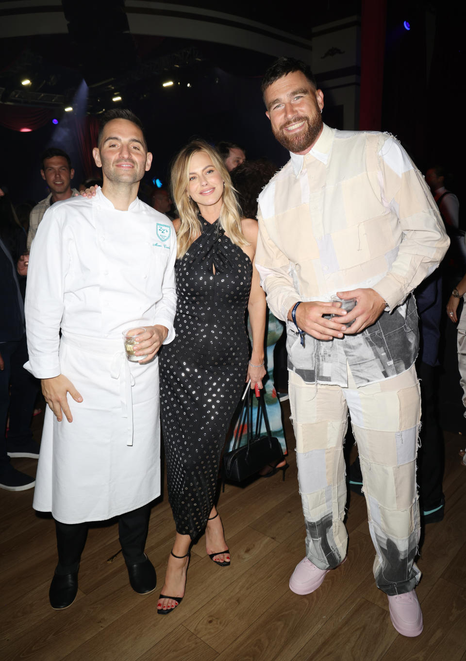 MIAMI BEACH, FLORIDA - MAY 05: Mario Carbone, Cait Bailey and Travis Kelce attend American Express Presents CARBONE BEACH on Sunday, May 05, 2024 in Miami Beach, Florida.  (Photo by Alexander Tamargo/Getty Images for American Express Presents CARBONE BEACH)
