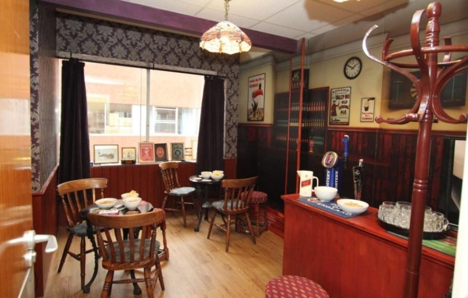 A 'memories pub' complete with replica beer taps and vintage posters at Wirrals Arrowe Park hospital (PA)