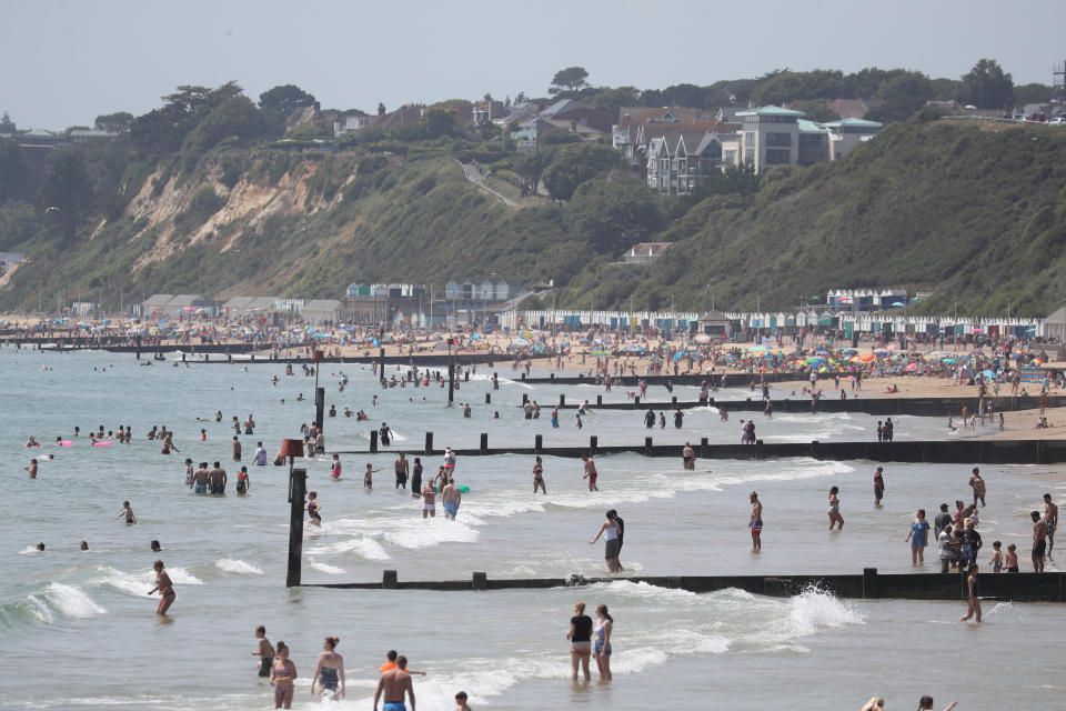 People flock to the beach in Bournemouth, Dorset, to make the most of the June heatwave.