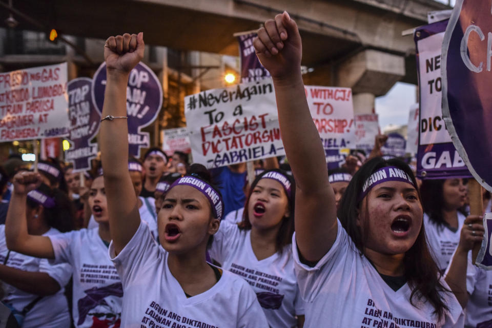 Women join a protest march for International Women's Day.