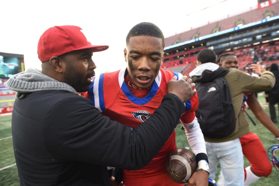 Raeden Oliver, #10, QB, of East Orange Campus is celebrated as his team beat Clifton 30 to 24 in third overtime in the North Group 5 Regional Championship Football Gam eat Rutgers SHI Stadium in Piscataway on 12/05/21.