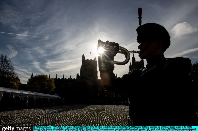 A lone bugler sounds the Last Post -Credit:Getty Images