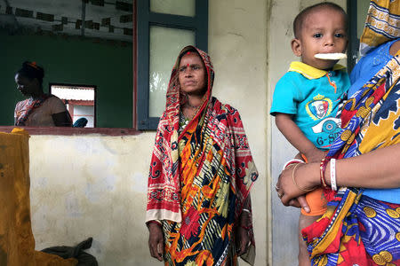 FILE PHOTO: A hindu family stays in a shelter near Maungdaw, in the north of Rakhine state, Myanmar, September 12, 2017. REUTERS/Stringer/File Photo